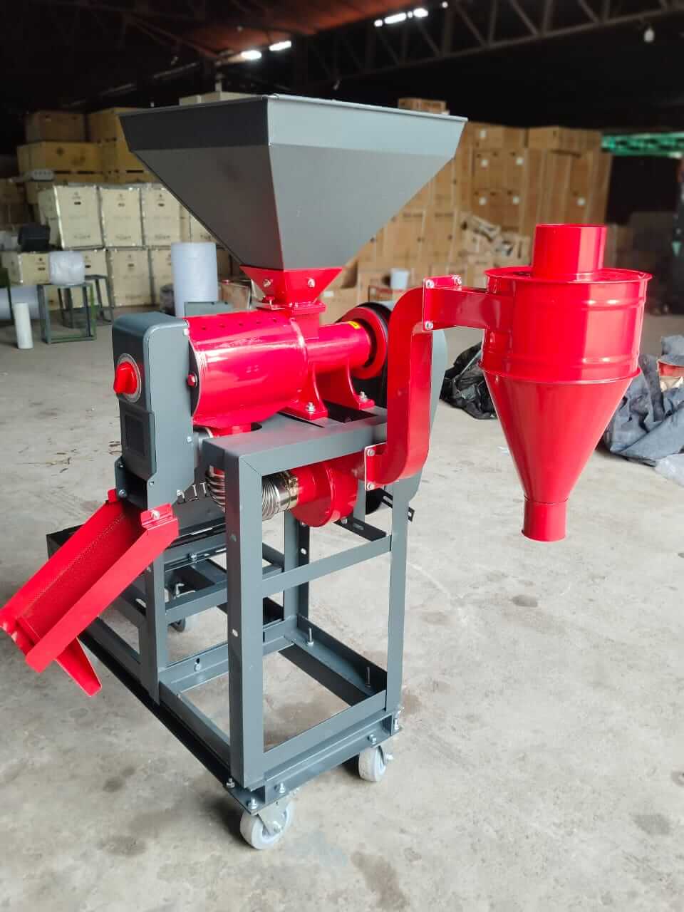 6N70 Mini Rice Mill Machine, a compact and efficient milling solution in a warehouse setting.