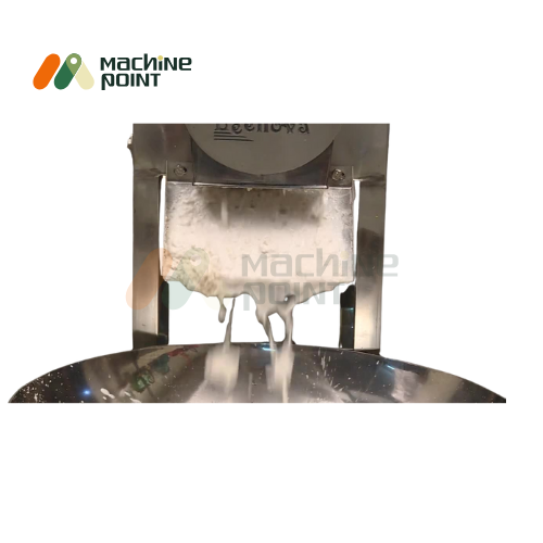 Gravy Machine Output – Smooth Paste Dispensing from Unit
Close-up of processed white gravy being dispensed from machine into collection tray.