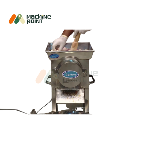 Gravy Making Machine in Use – Hopper Filled with Vegetables
Operational view of gravy machine with user adding ingredients, showcasing efficient grinding and processing.