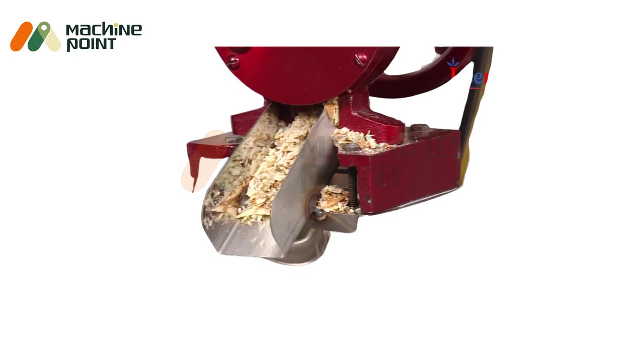 Close-up of dry fruit chips being processed in the Hand Dry Fruit Chips Machine – stainless steel chute showing uniform slices.