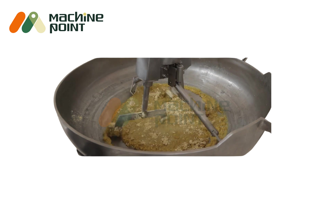 Close-up of 4-feet halwa machine mixing brown halwa mixture using stainless steel stirrer arms.