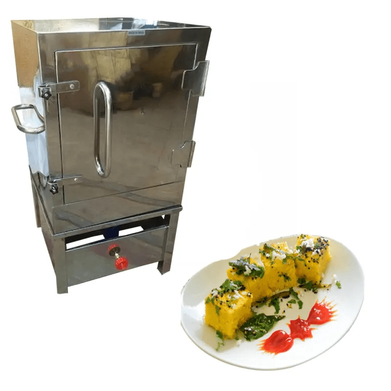 12 Tray Dhokla Machine shown beside a plate of freshly steamed dhokla – perfect for restaurants, caterers, and halwai shops.