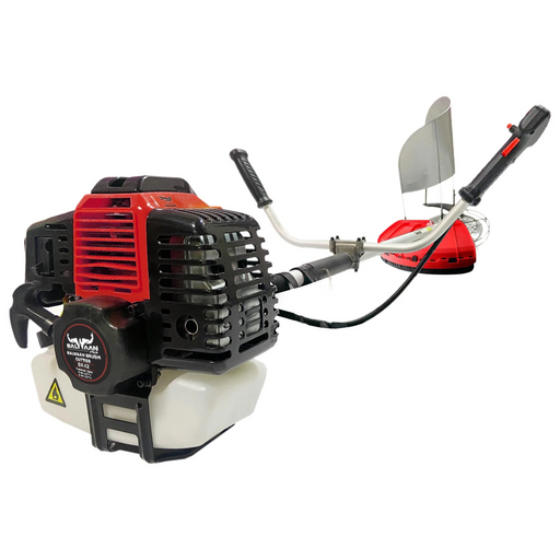Close-up angled view of Balwaan BX-52 2-stroke brush cutter featuring red and black engine with white fuel tank, ergonomic handle, metal guard, and cutting blade setup.