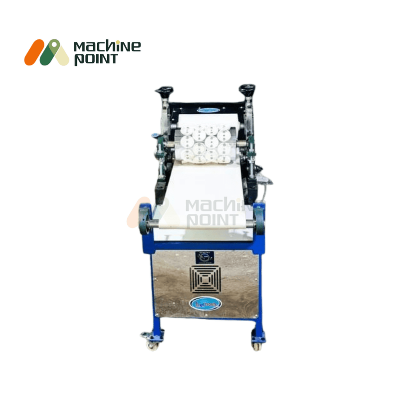 Panipuri Making Machine with stainless steel rollers and conveyor belt visible from the front; circular dough cutouts aligned on the conveyor.