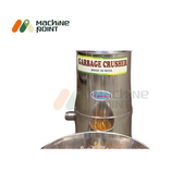 Mid-operation view of the Garbage Crusher Machine ejecting finely crushed waste through the bottom outlet.