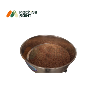 Top view of stainless steel grain hopper filled with raw whole grains, suitable for flour mill.