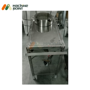 Overhead view of the stainless steel masala grinder showcasing the round inlet hopper and polished finish, designed for efficient spice grinding.