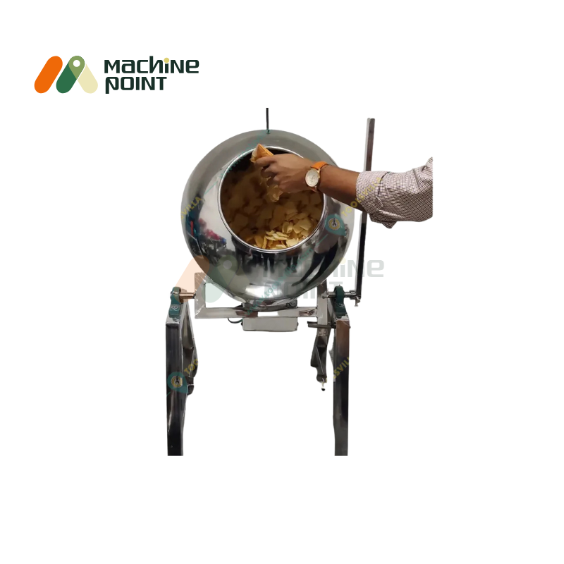 Hand loading potato chips into 0.5HP coating pan machine for even masala mixing.