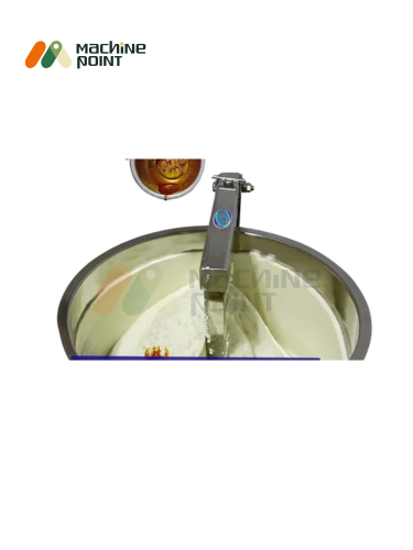 Close-up of shrikhand mixing process with ingredients being blended in 50 kg machine using automated paddle.