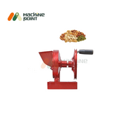 Side profile of Hand Dry Fruits Machine Big with visible handle and input hopper, includes dry fruits displayed above.