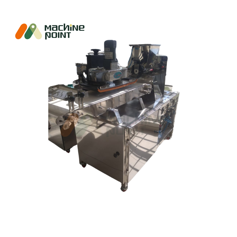 Side view of the  Jamun Ball Making Machine featuring a stainless steel body, electric motor, and precise shaping mechanism.
