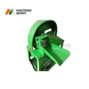 Top view of the green Bhaji Cutter highlighting the dual discharge outlets and protective blade housing.