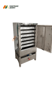 Open door view of  6 Tray Khaman Machine showing spacious trays for uniform steam cooking.