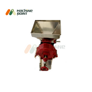 Top view of Wet Dal Machine showing stainless steel feeding hopper and red grinding chamber attached to a compact base.
