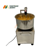 20 KG Besan Mixing Machine in action, flower-type blades mixing thick besan batter in a stainless steel bowl.