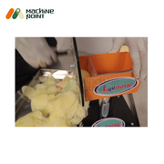 Hand-operated potato slice machine effortlessly slicing potatoes into thin, uniform chips.