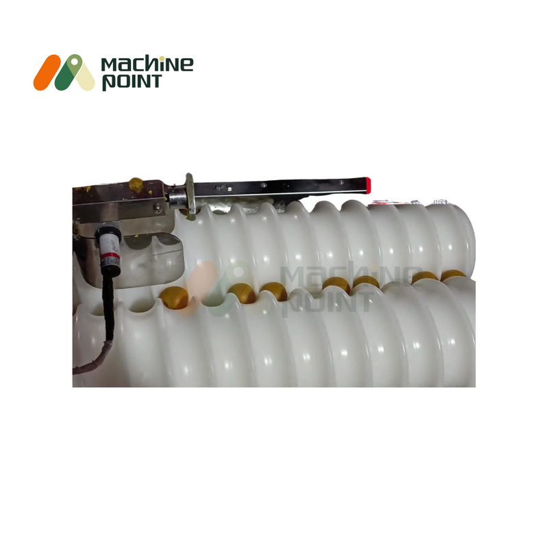 Close-up view of Laddu Making Machine’s roller system – shows precision laddu forming cavities in hygienic food-grade white rollers.