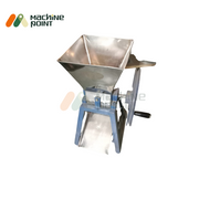 Side view of the Hand Chilly Cutter machine highlighting the turning wheel and discharge outlet.