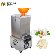 Garlic Peeler Machine - Commercial Garlic Peeling Equipment with Orange Hopper and Garlic Cloves Display.