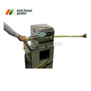 Sugarcane Cleaning Machine in use – showcasing real-time operation as sugarcane is fed into the stainless steel machine by hand, ideal for efficient outer surface cleaning of cane.