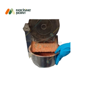 Processed Tomato Gravy Dispensed from 7 HP Machine
Close-up of tomato gravy being collected from machine outlet into stainless container, suitable for mass food prep.
