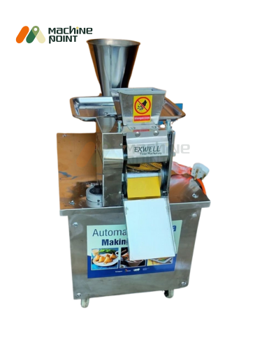 Vertical view of small samosa machine with conveyor belt and safety warning label.
