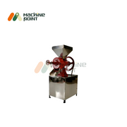 Side profile of Wet Dal Machine showing red cast iron grinding body with stainless steel stand and funnel-shaped hopper.
