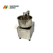Top view of flower-type besan mixer in action with dry flour for batter preparation.
