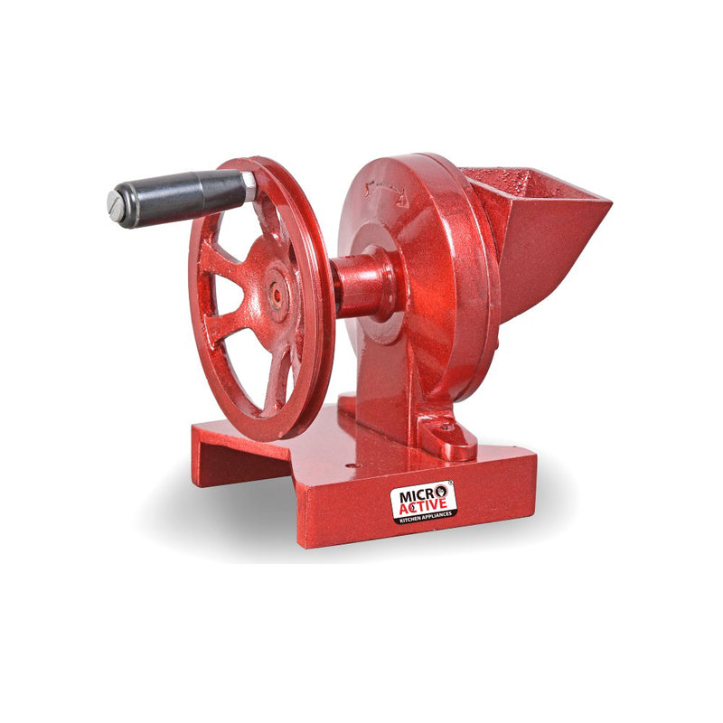Hand Dry Fruits Machine Big in red cast iron body with handwheel and feeding hopper, used for manual chopping and grinding of dry fruits.
